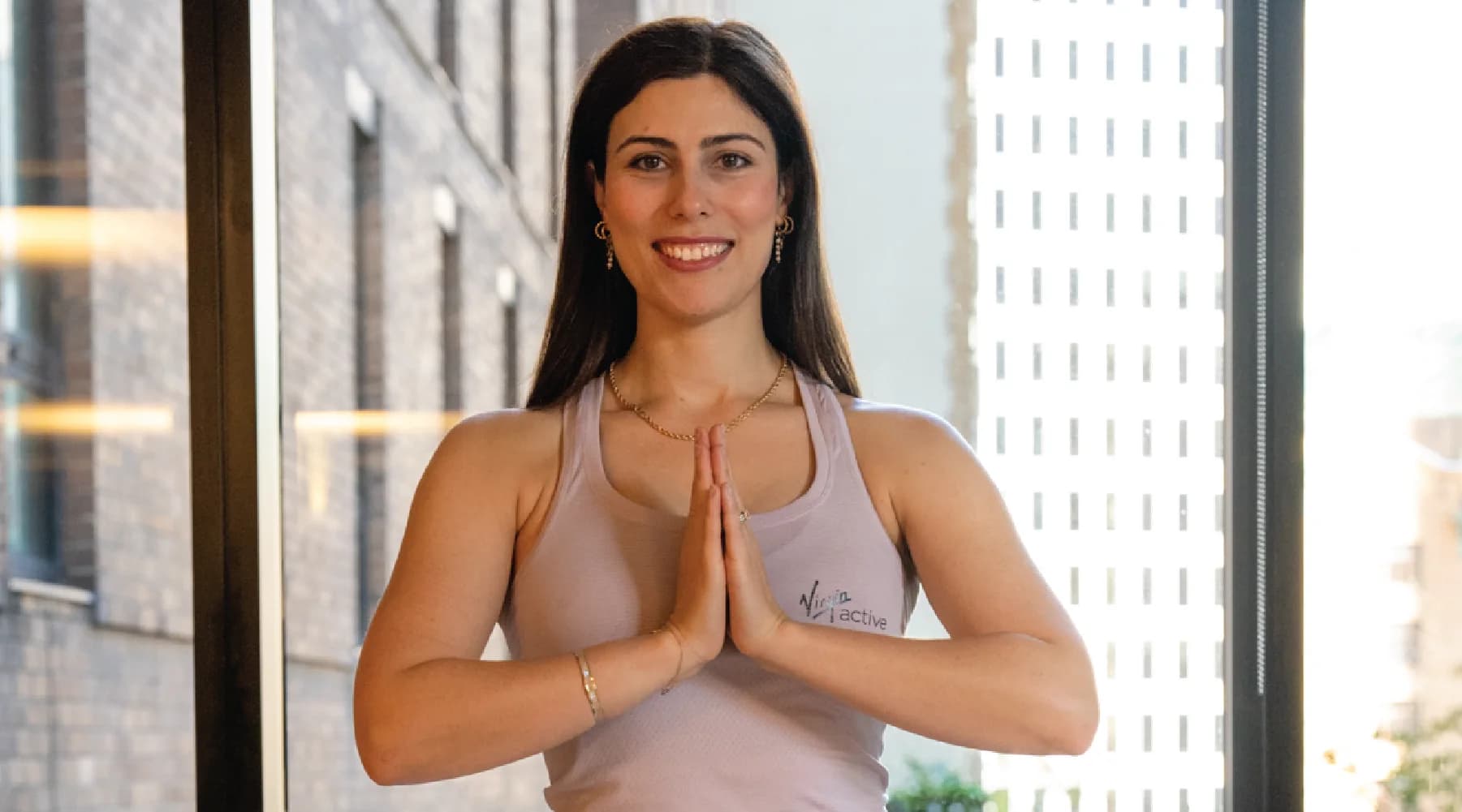 Black-and-white portrait of Mahsa Javam, Yoga Teacher behind virginactive.com.au