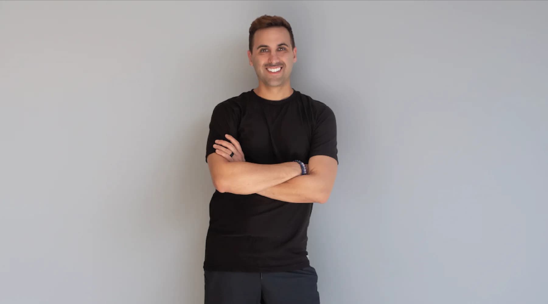 Black-and-white portrait of Anthony Fontana, Teacher Training behind amfpeakperformance.com