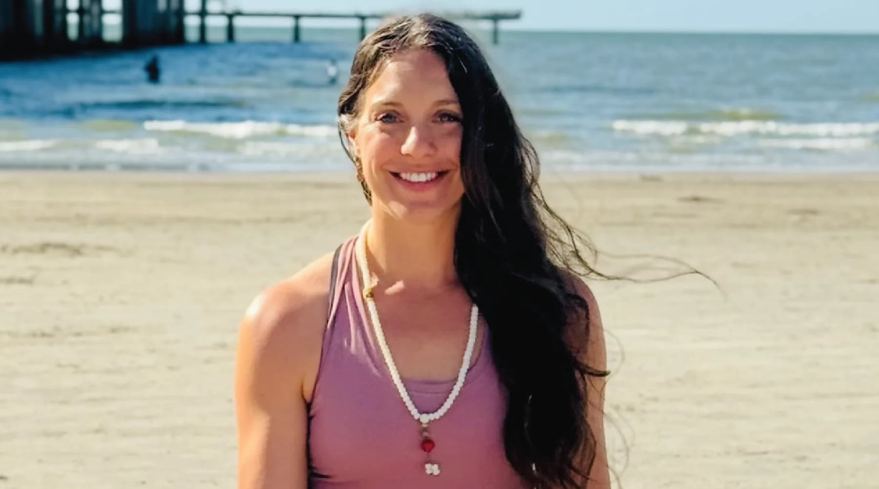 Black-and-white portrait of Camille Shaw, Yoga Teacher behind Yoga Teacher